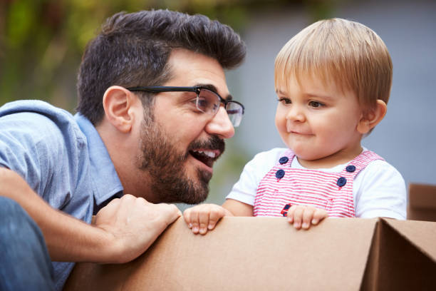 istock Father Playing With Son In Cardboard Box 640229040