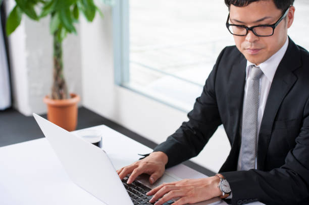 istock Businessman who works on a laptop computer 640229192