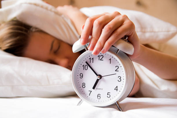 istock Woman hiding under pillow upon waking up 640229718