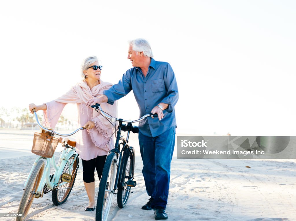 Great vacation for  senior people Senior couple biking in California Cycling Stock Photo