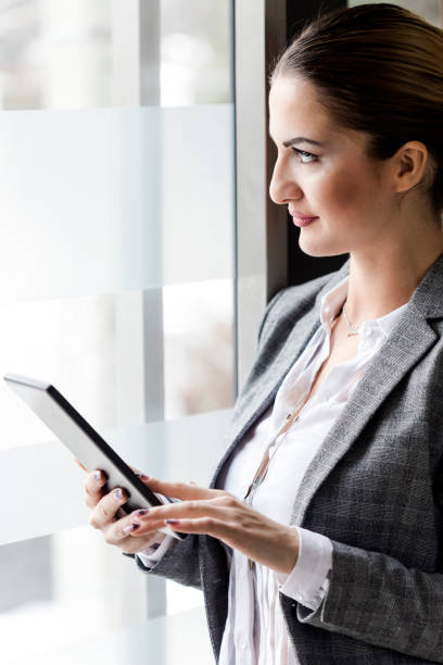 istock Businesswoman working on tablet 640230744