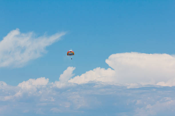 Parachuting towing by a boat