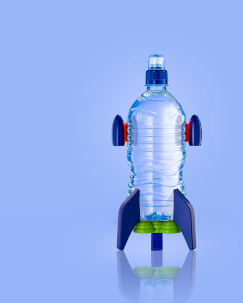 Water Bottle In The Form Of A Rocket On Blue Stock Photo
