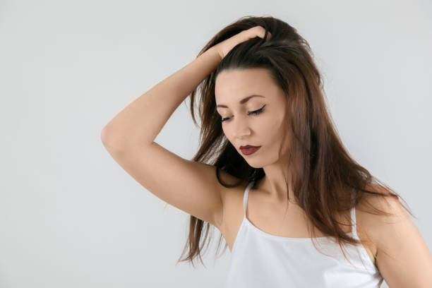 istock Attractive woman with eyes closed on white background 640233730