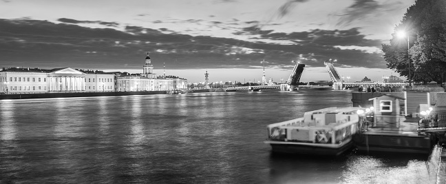 The raised Palace bridge at white nights in the city of St.-Petersburg , black-and-white image