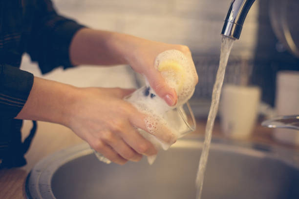istock Woman washing dishes. 640236116