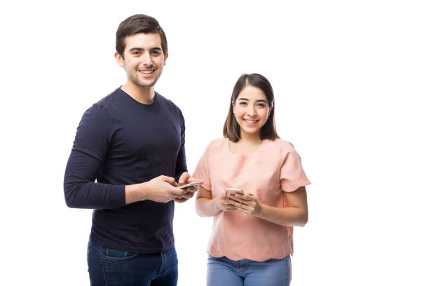 istock Young Hispanic couple with smartphones 640236410