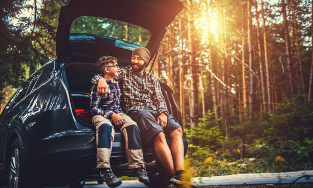 istock Father and son travelling by car 640236592