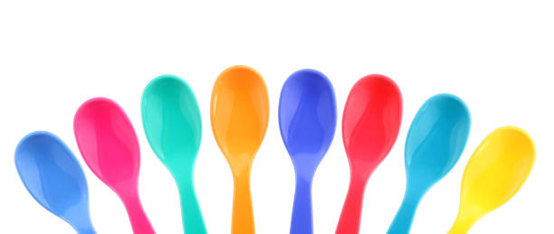 Eight colorful plastic spoons Here are eight colorful plastic spoons. baby spoon stock pictures, royalty-free photos & images