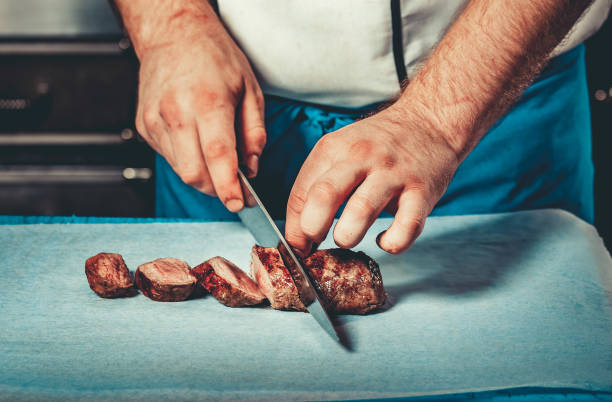 istock Busy chef at work in the restaurant kitchen 640238382