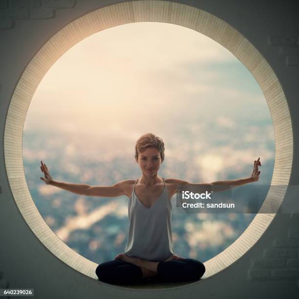 Young Woman Sitting In Lotus Posture Stock Photo - Download Image Now - Circle, Inside Of, Sitting