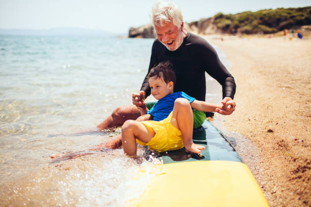istock Grandpa's teaching me to surf 640240206