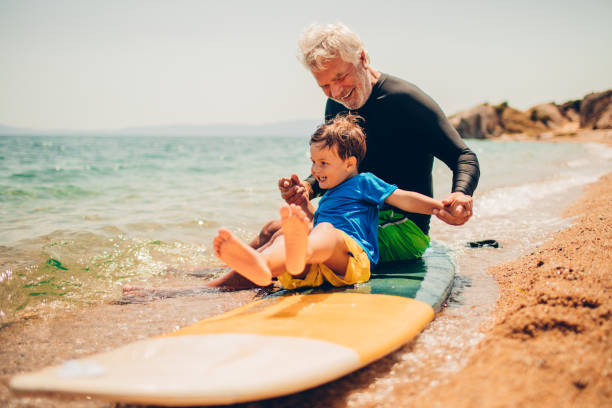 istock Grandpa's teaching me to surf 640240484