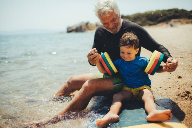 istock Grandpa's teaching me how to surf 640241962