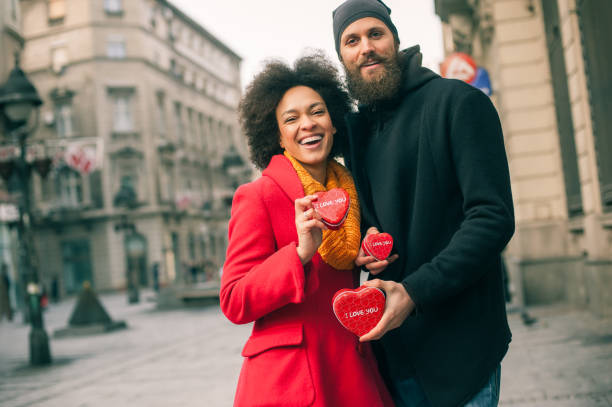 istock Beautiful young lovers holding a three red hearts 640242524