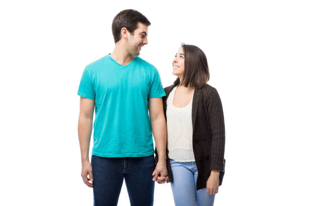 istock Couple holding hands and looking at each other 640243282
