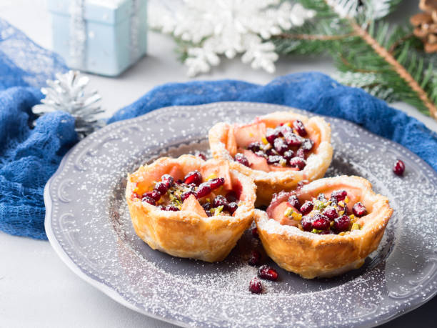 istock Christmas mini apple pies with pomegranate seeds 640244316