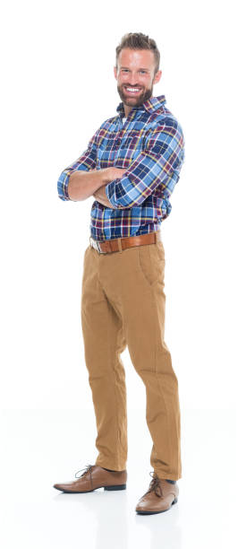 istock Smiling man standing with arms crossed 640248596