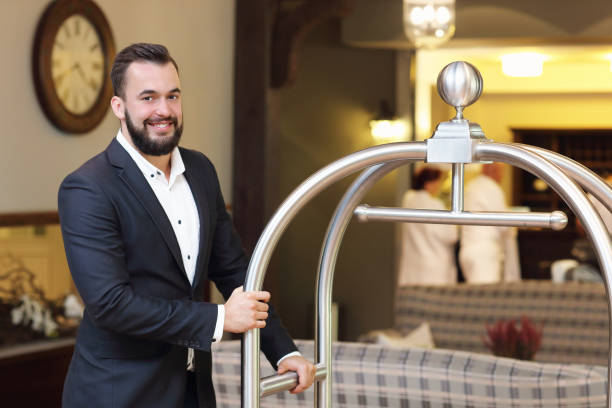 Bellboy in hotel Picture of bellboy in hotel bellhop stock pictures, royalty-free photos & images