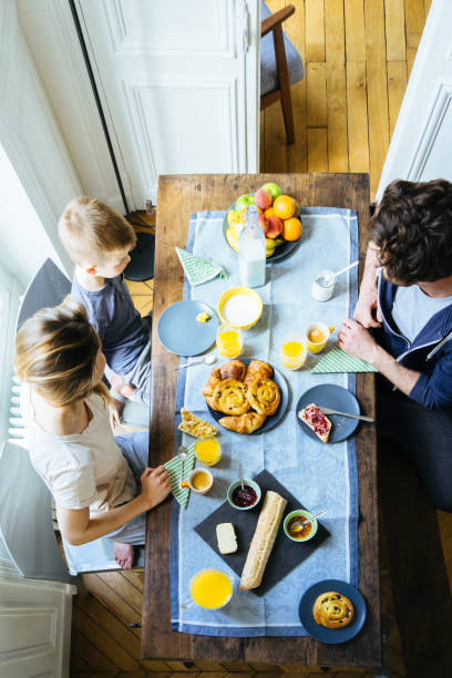 istock Happy Family Having Breakfast Together Overhead View 640249064