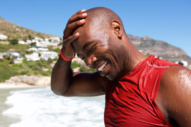 istock Happy african man at the beach after a swim 640249176