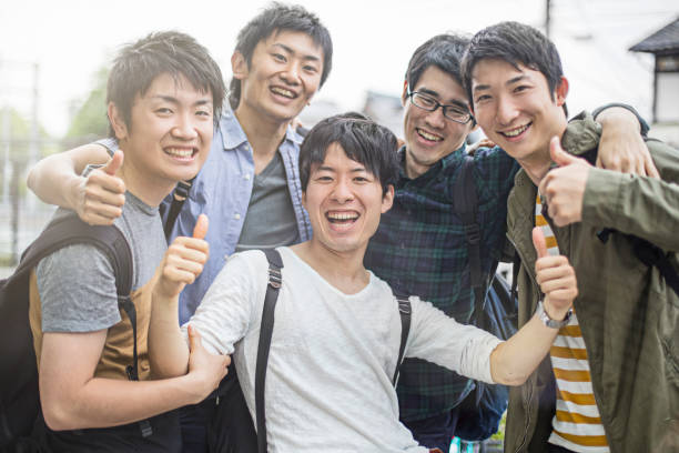 istock Cheerful university students gesturing thumbs up 640249772