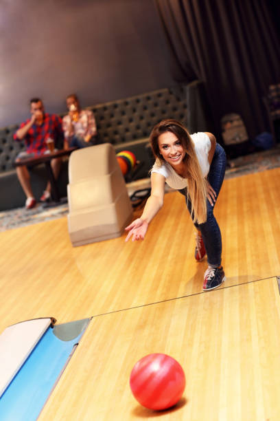 istock Group of friends playing bowling 640250026