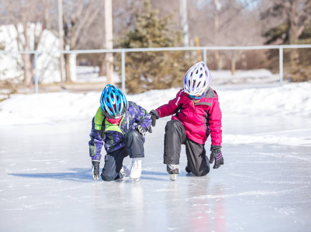 istock Two Girls' First Time Ice Skating 640251422