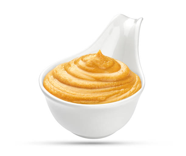istock Mustard in bowl isolated on white background 640251890