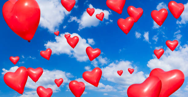 istock Heart Shape Balloons into blue sky 640251948