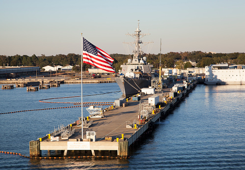 Navy ship in the port, background with copy space, full frame horizontal composition