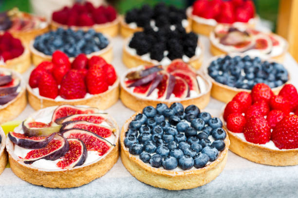 istock Fruit and berry tarts dessert tray assorted outdoors 640255264