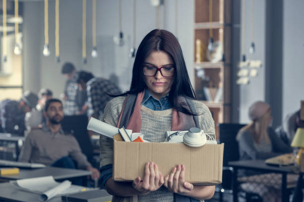 Fired Portrait of a young business woman fired from a job. firing stock pictures, royalty-free photos & images