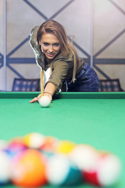 istock Pretty woman playing billards 640258094