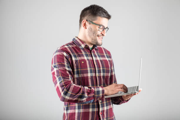 istock Bearded man holding laptop 640259036