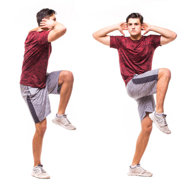 istock High knee squat. Young man doing sport exercise. 640259948