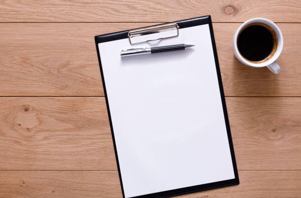 istock Mockup for checklist, note paper and coffee on wood background 640260450