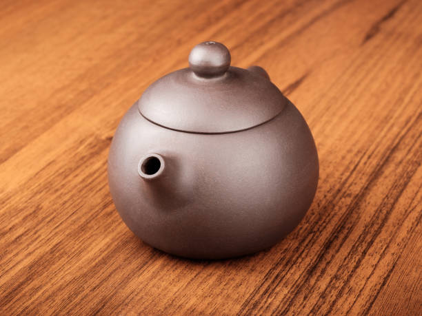 istock Chinese teapot on woden desk 640260558