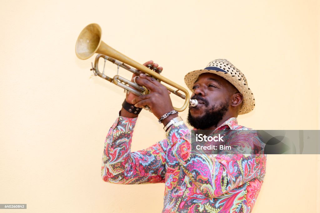 Cuban musician playing trumpet, Havana, Cuba Cuban musician playing a trumpet outdoors, Havana, Cuba Trumpet Stock Photo