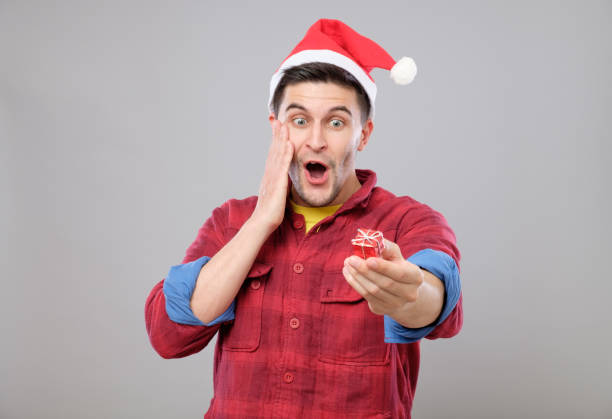 istock Guy holding a Christmas gift 640261544