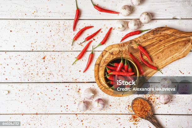 Chilli Peppers And Garlic Background Stock Photo - Download Image Now - Chili Pepper, Table, Spice