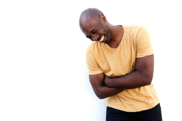 istock Cheerful black guy standing with arms crossed 640262522