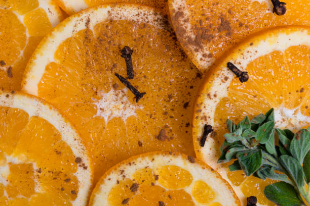 istock Orange fruit with cinnamon on wooden texture background 640262660