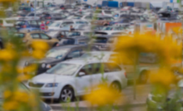 istock Blurry car park next to modern mall, background abstract 640262752