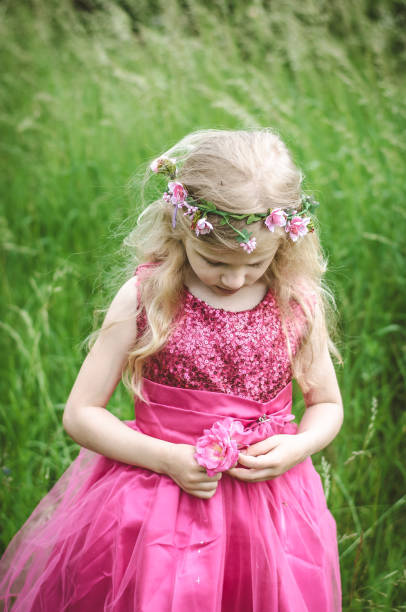 istock sad girl with flowers 640265624