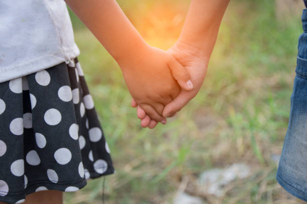 istock Young girl holding their hands 640266052