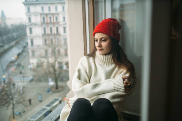 istock Pretty young woman chilling out on window 640266366