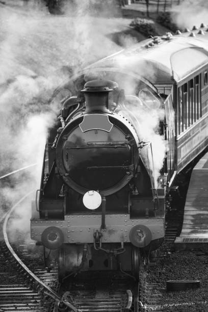 istock Restored Victorian era steam train engine with full steam 640266424