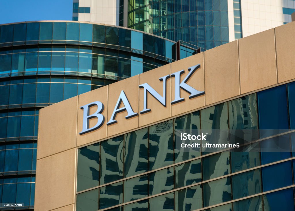 Bank building Bank sign on glass wall of business center Bank - Financial Building Stock Photo