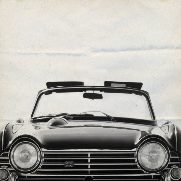 oldtimer, car in black wallpaper background on crumbed paper, with alternative energy, windmill